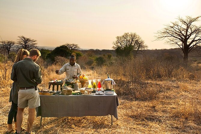 5-Day Lakes and Masai Mara Plains 4 x 4 Safari - Lake Nakuru National Park: flamingos, rhinos, and lunch with a cliff view